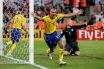 Henrik Larsson of Sweden celebrates scoring against England
