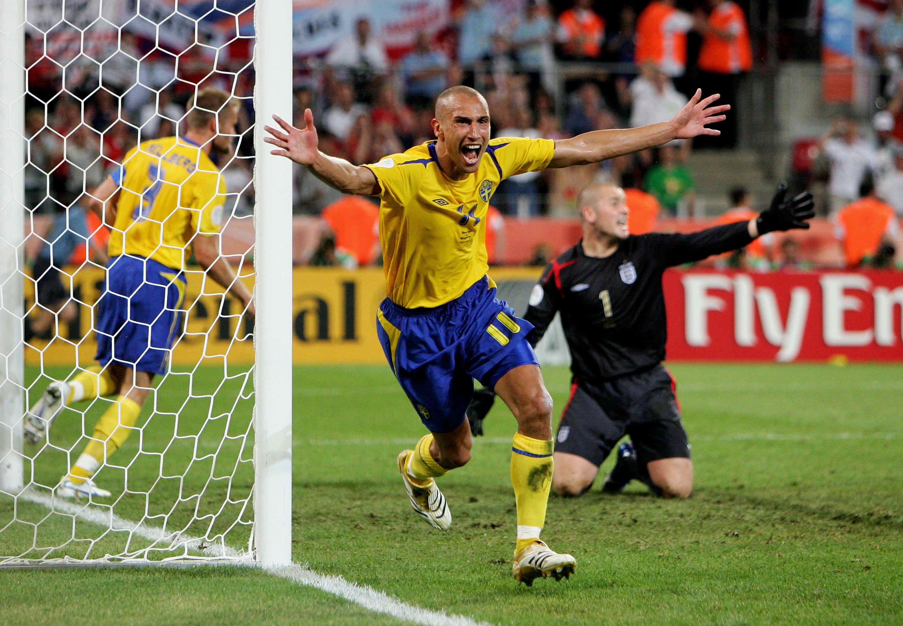Henrik Larsson of Sweden celebrates scoring against England