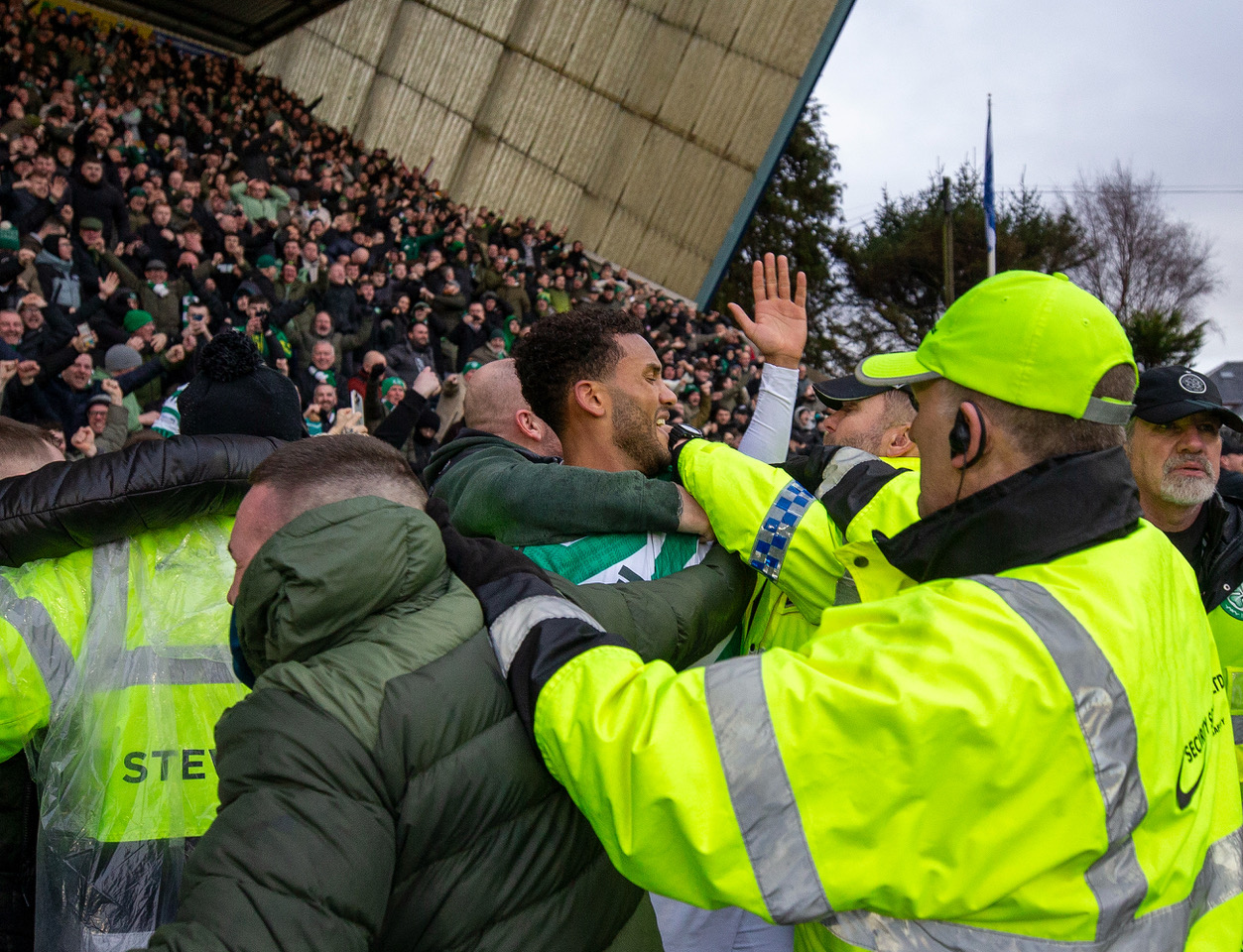 Auston Trusty celebrates with the Celtic supporters.