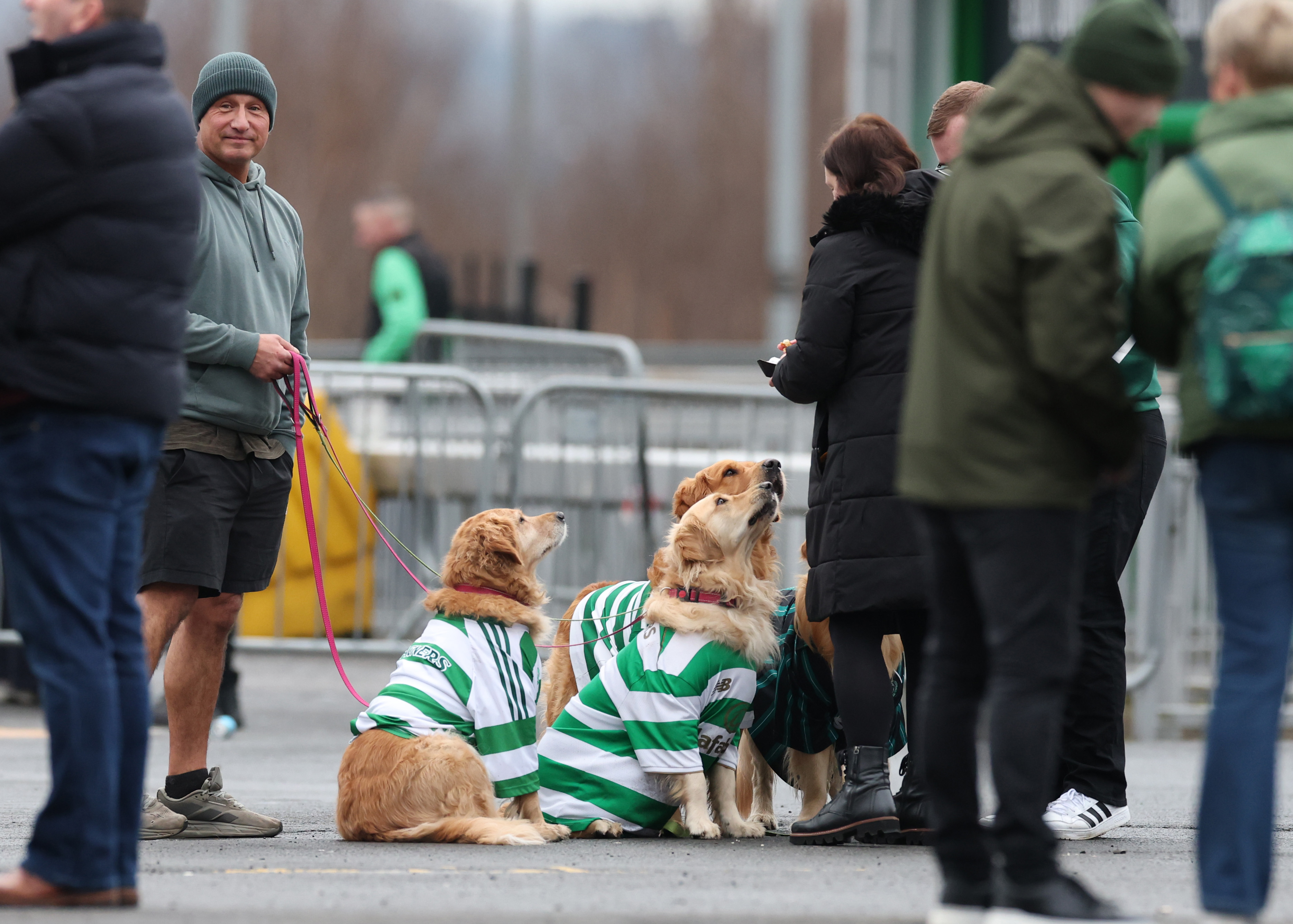 Celtic fans with their dogs are seen during the Scottish Premiership match