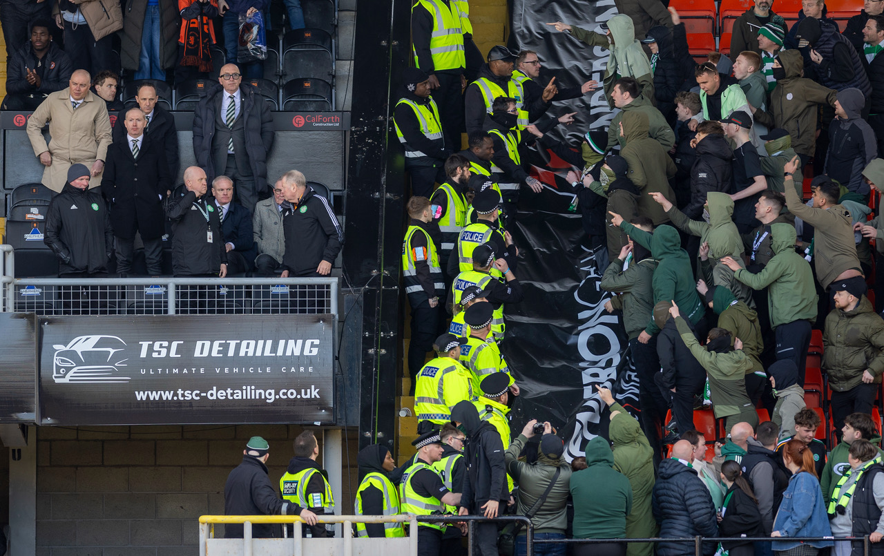Celtic fans and the Celtic Board at Tannadice.