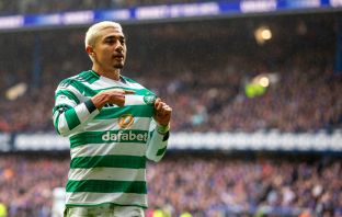 Julian Araujo holds the Celtic badge