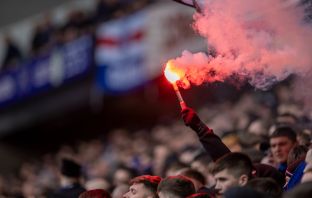 Rangers fans with a pyrotechnic