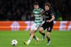 Colby Donovan of Celtic battles for possession with Filip Rozga of Sturm Graz
