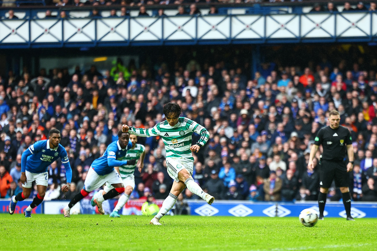 Reo Hatate of Celtic takes the penalty kick at Ibrox
