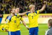 Benjamin Nygren of Sweden celebrates with teammates Gustaf Lagerbielke and Lucas Bergvall